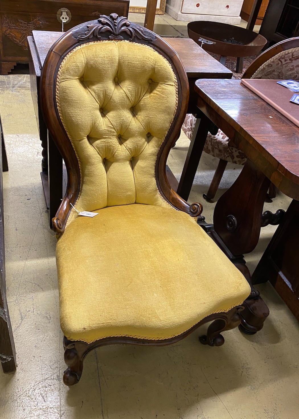 A Victorian walnut spoon back nursing chair